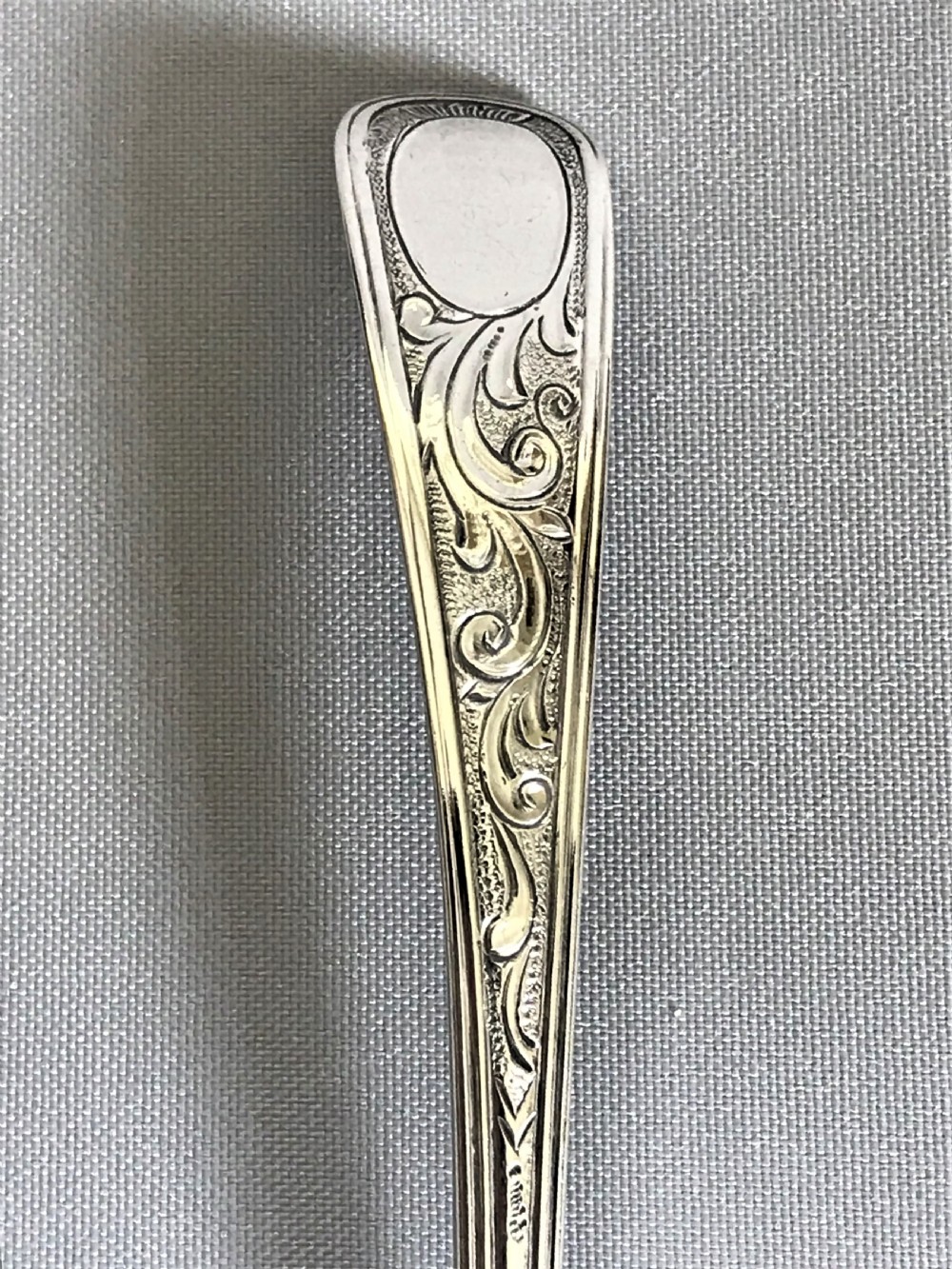 A delightful 18th Century silver cream ladle View III