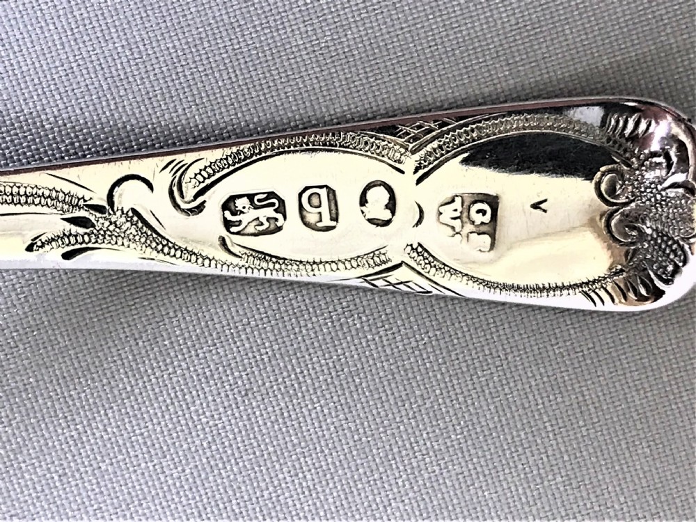 A delightful 18th Century silver cream ladle View V