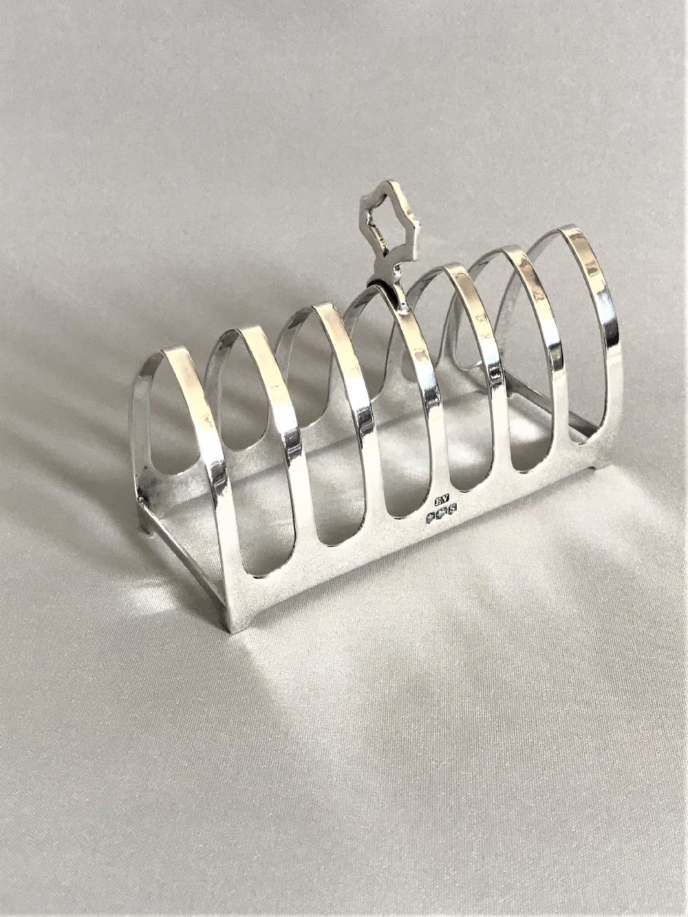 A Gothic design six slice silver toast rack 