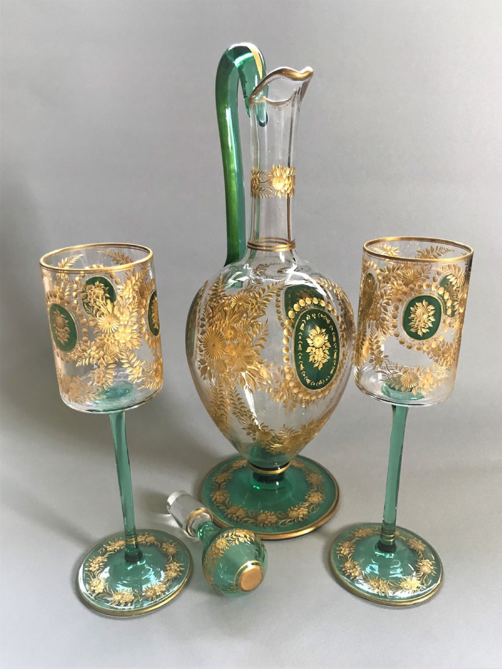 A fabulous Moser gilded wine jug and glasses View VII