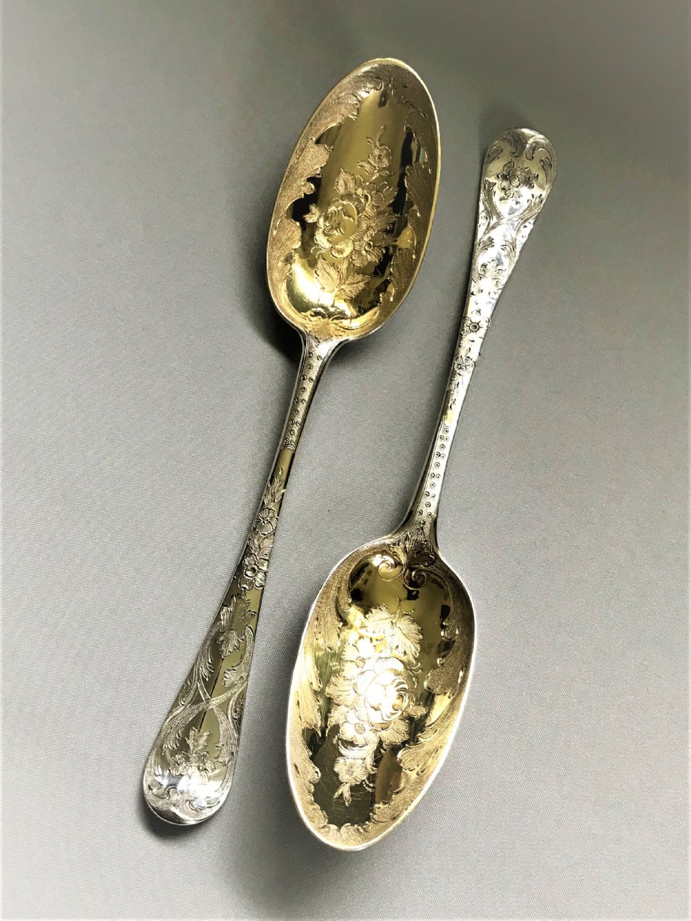 A wonderful pair of George II silver gilt dessert servers