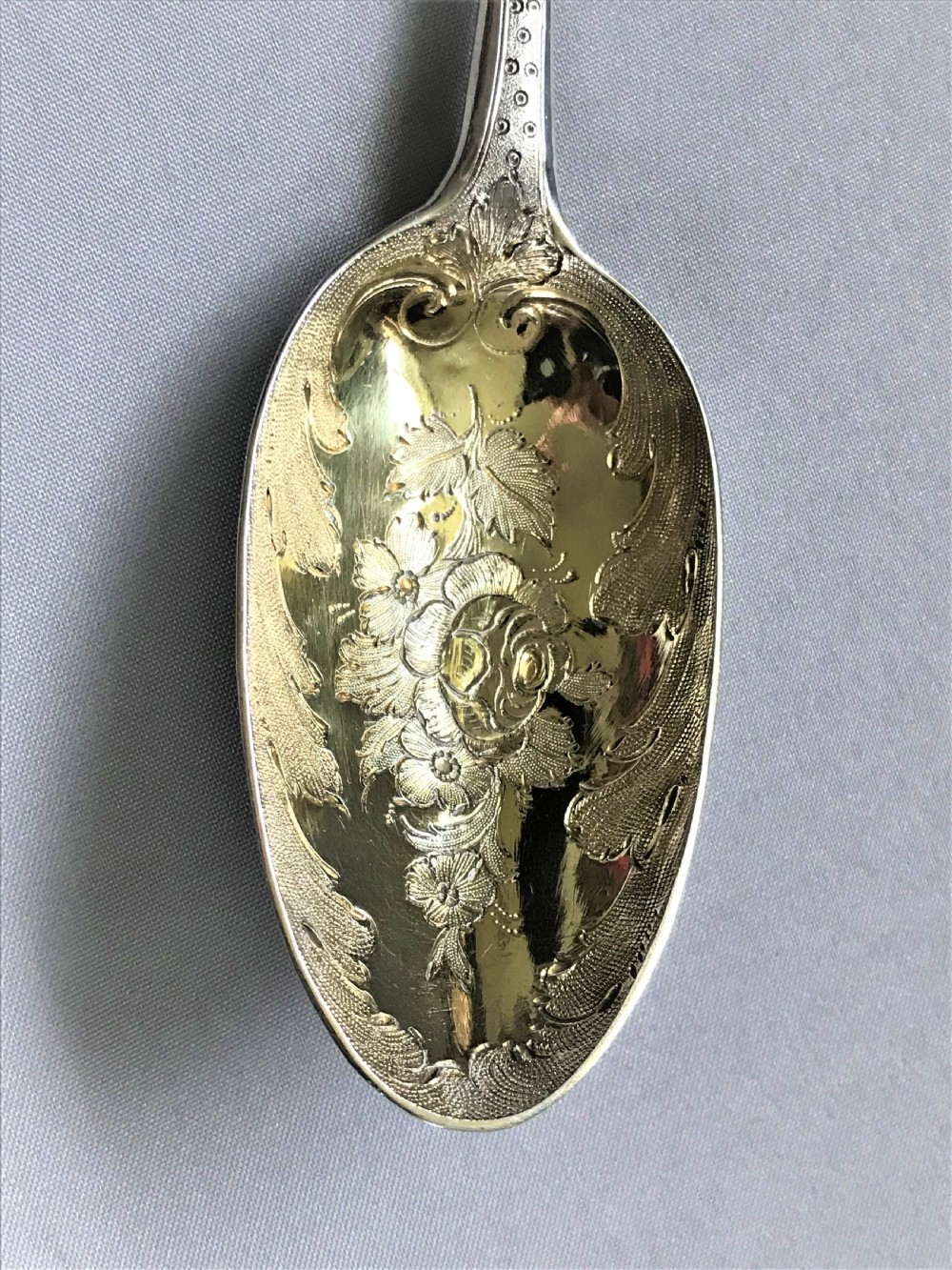 A wonderful pair of George II silver gilt dessert servers View V