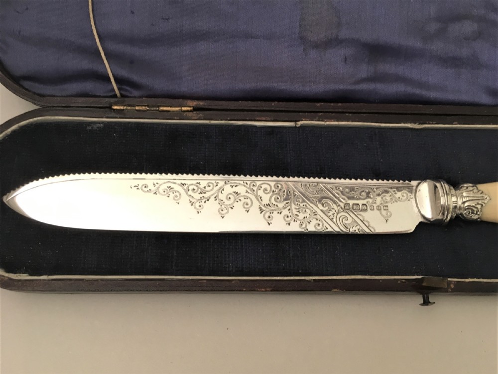 A superb Boxed Victorian Solid Silver Wedding Cake Knife View V