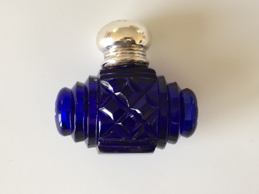 A lovely Barrel Cut Victorian Silver Mounted Scent Bottle