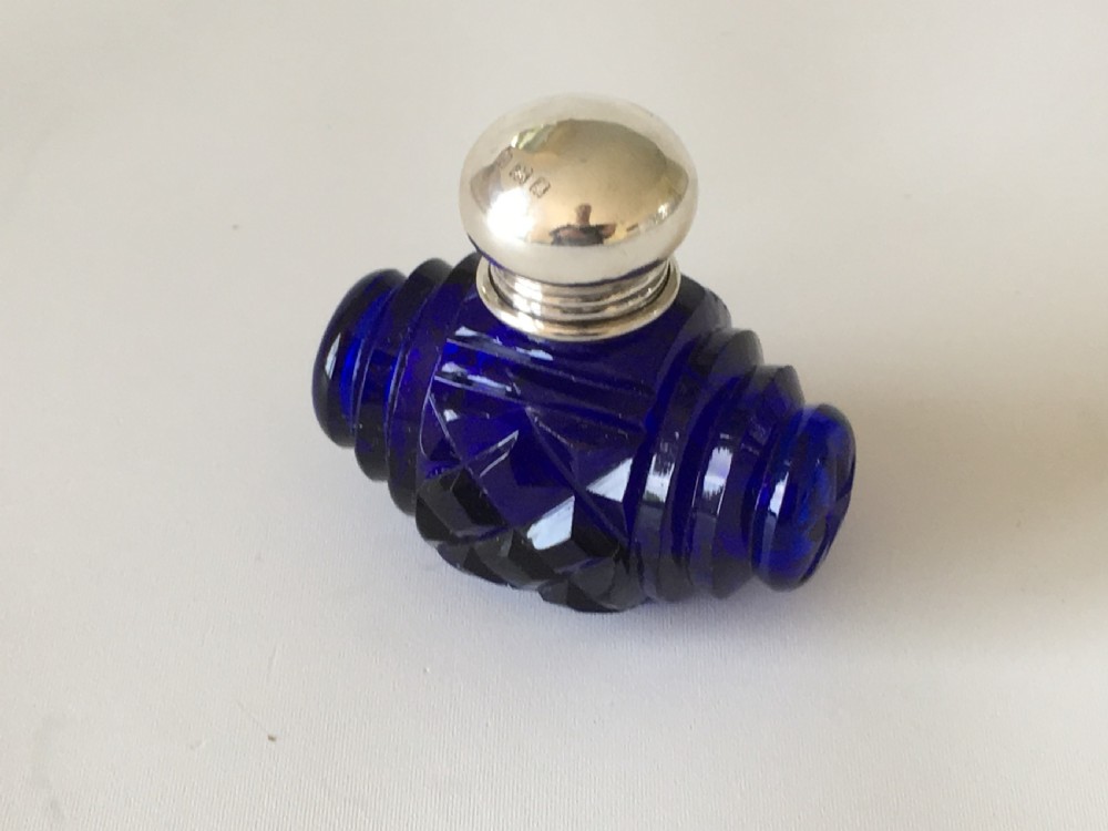 A lovely Barrel Cut Victorian Silver Mounted Scent Bottle View II
