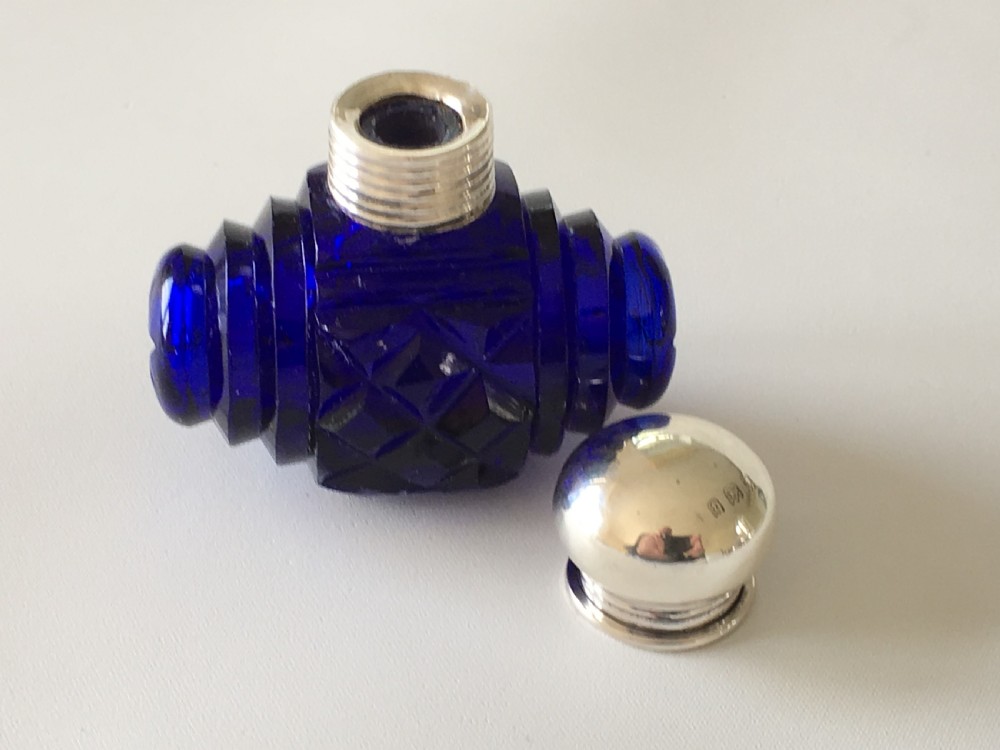A lovely Barrel Cut Victorian Silver Mounted Scent Bottle View V