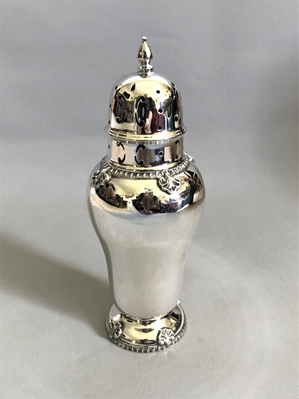 A stylish silver sugar caster