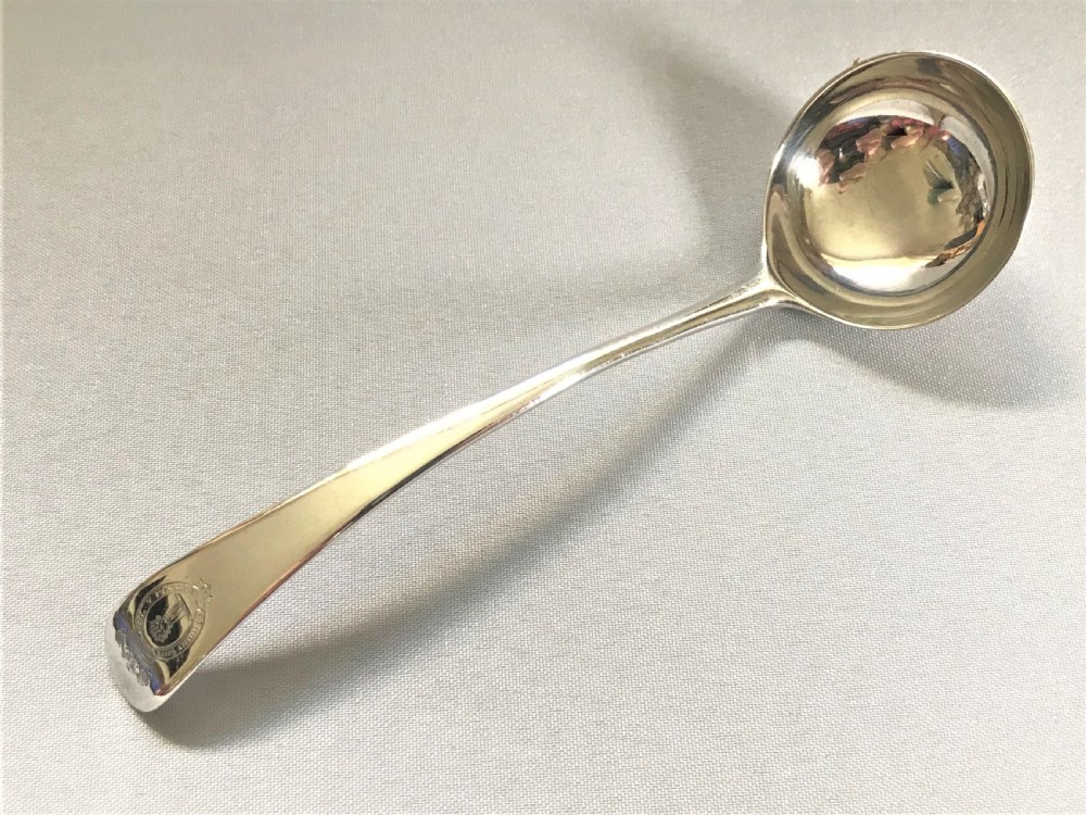 An elegant Georgian silver cream ladle