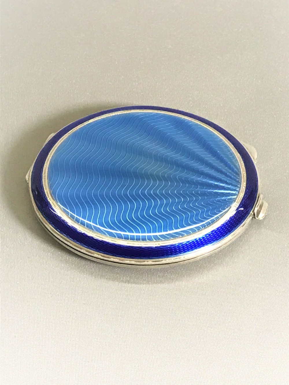 A fabulous Art Deco bi-coloured silver & enamel compact