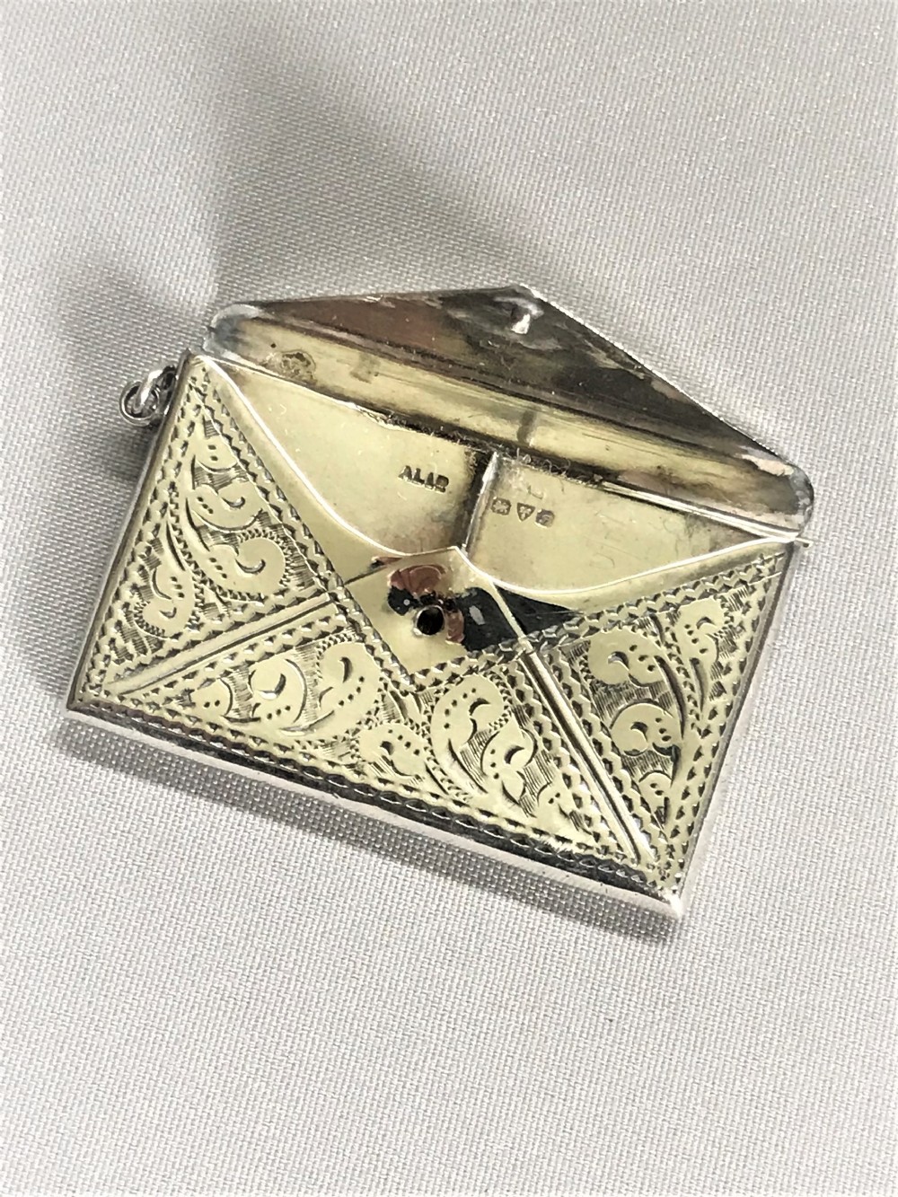 A lovely Chester silver double stamp case
