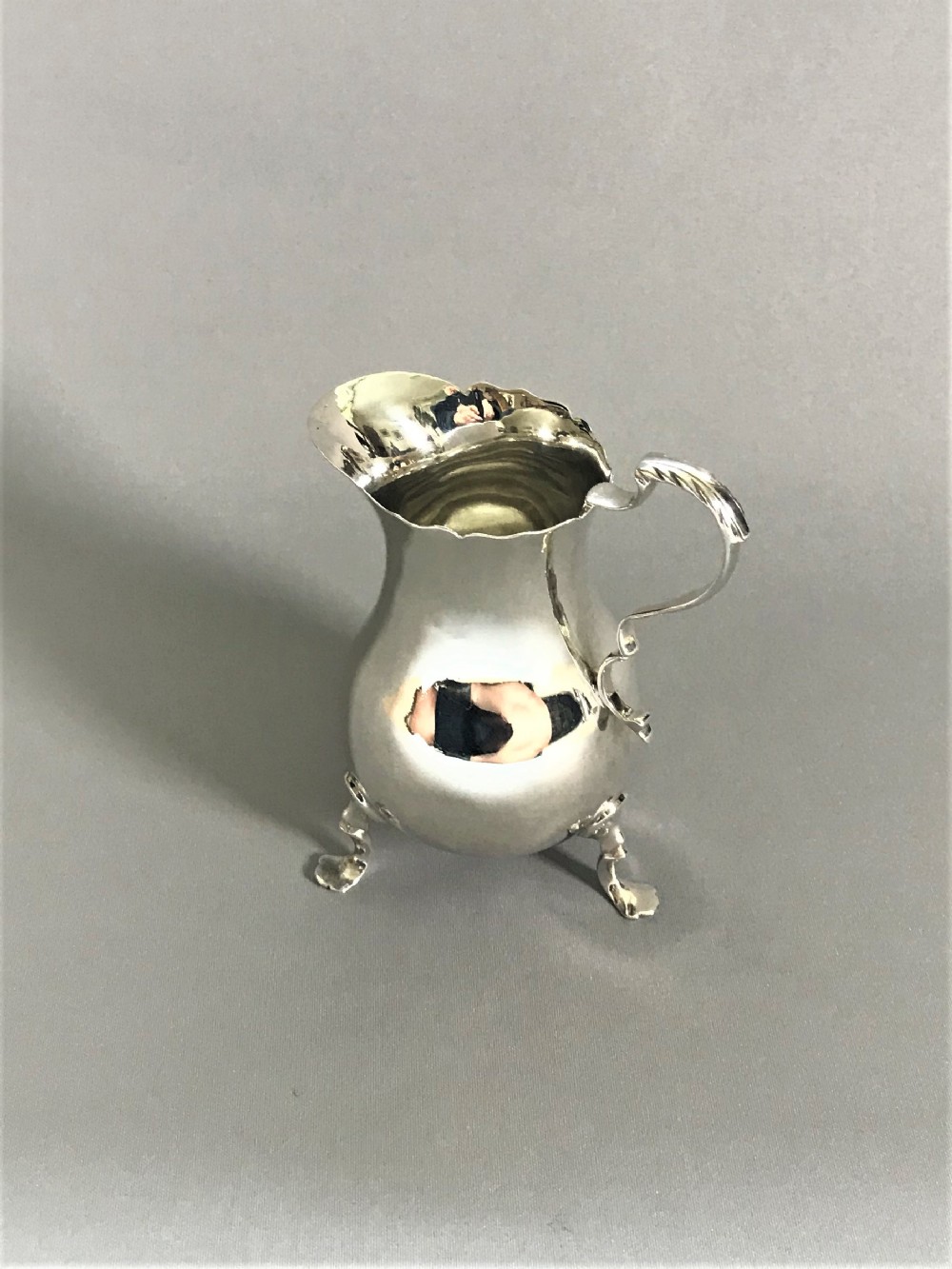 A lovely Edwardian baluster silver cream jug