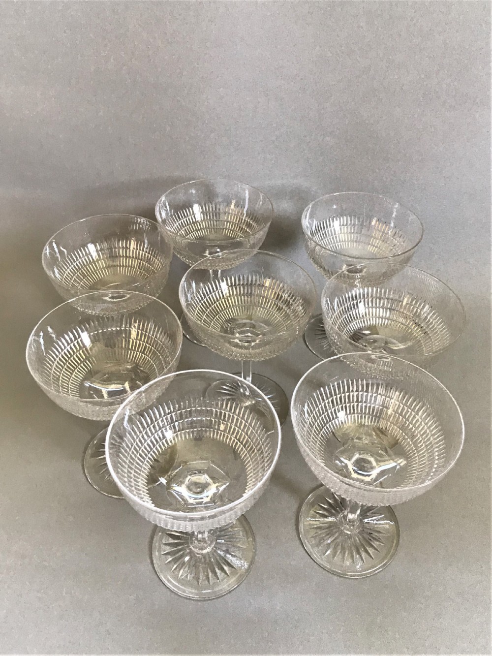 A fine set of 8 cut glass Edwardian champagne bowls View II
