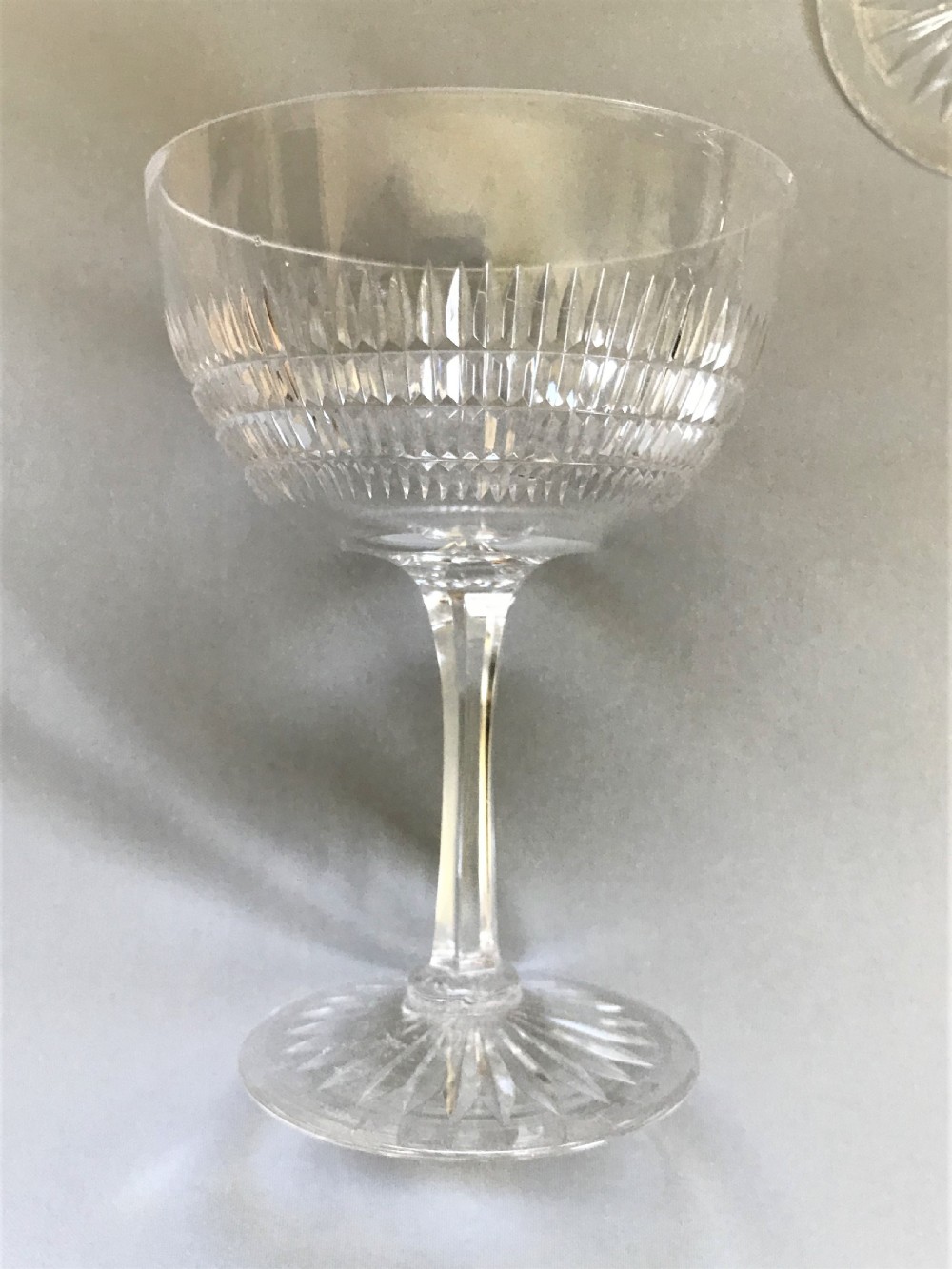 A fine set of 8 cut glass Edwardian champagne bowls View V