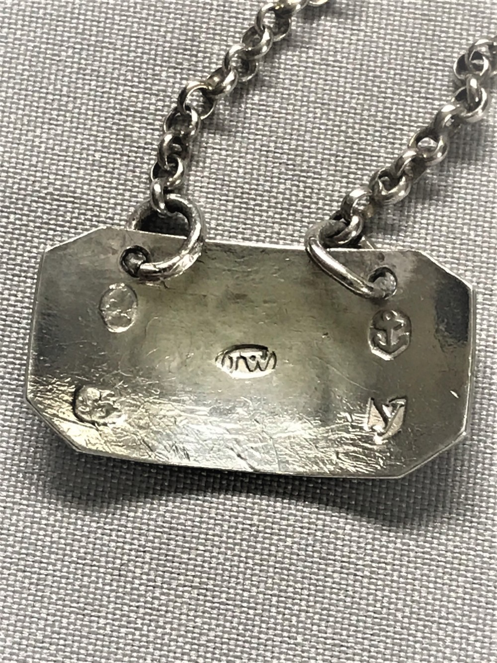 A rare Georgian silver 'Anchovie' sauce label View III