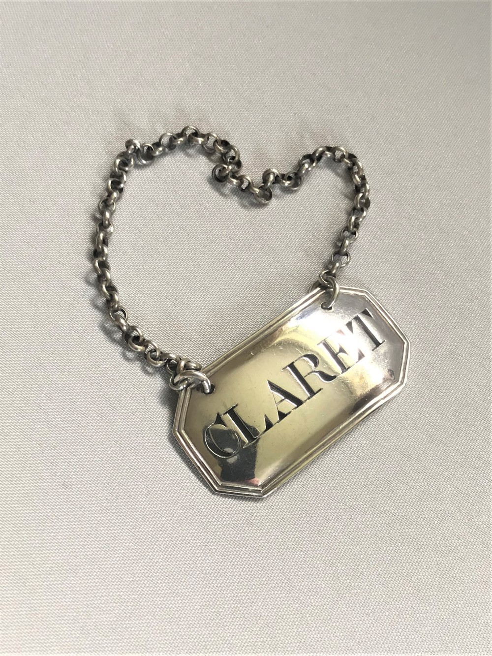 A lovely Georgian silver, claret decanter label