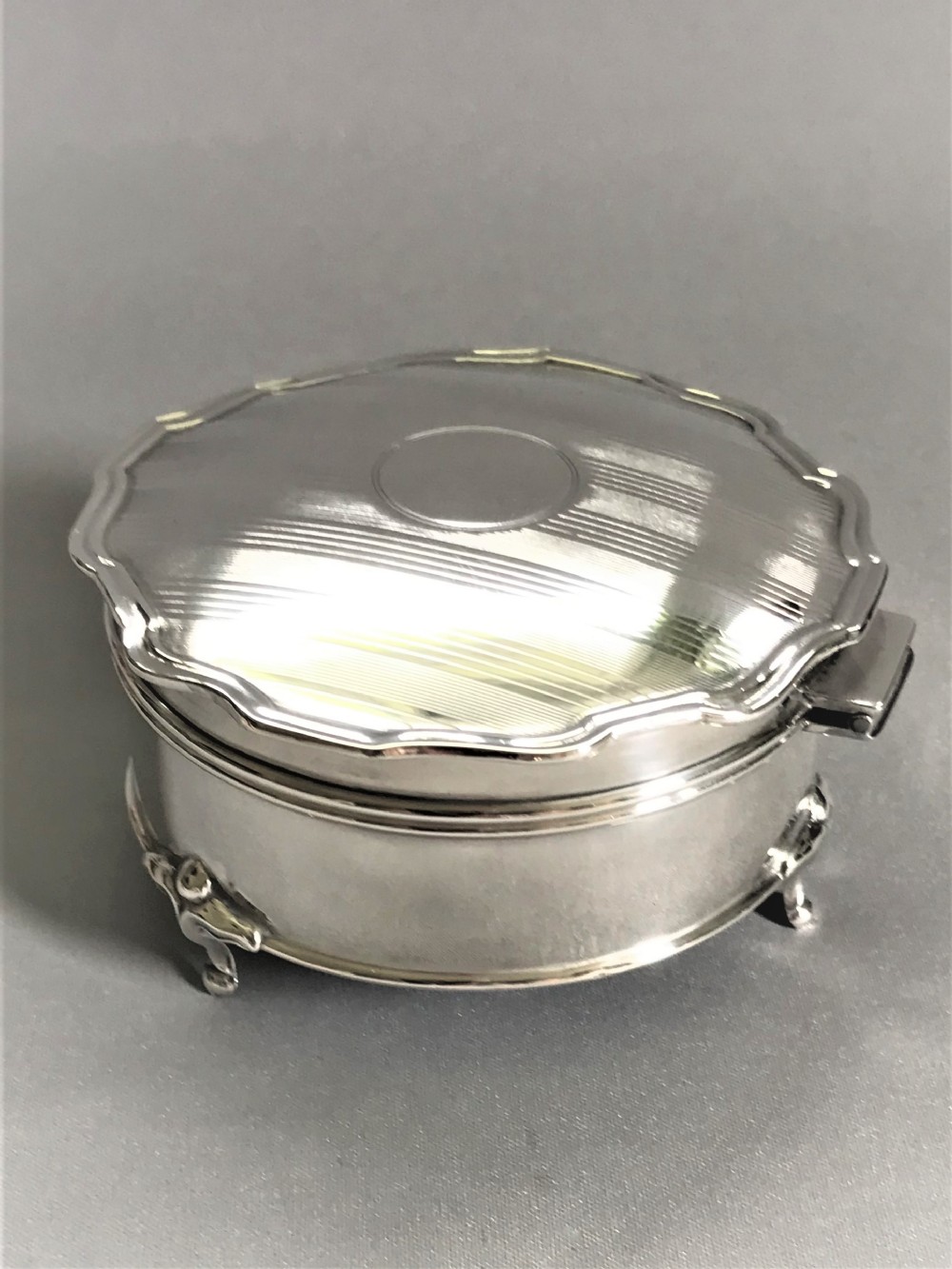 A stylish silver trinket/cuff links box