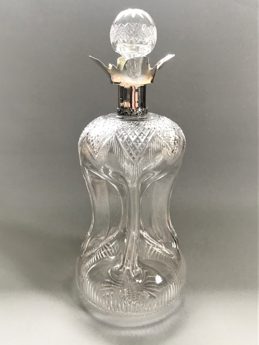 A superb Edwardian silver mounted glug glug decanter