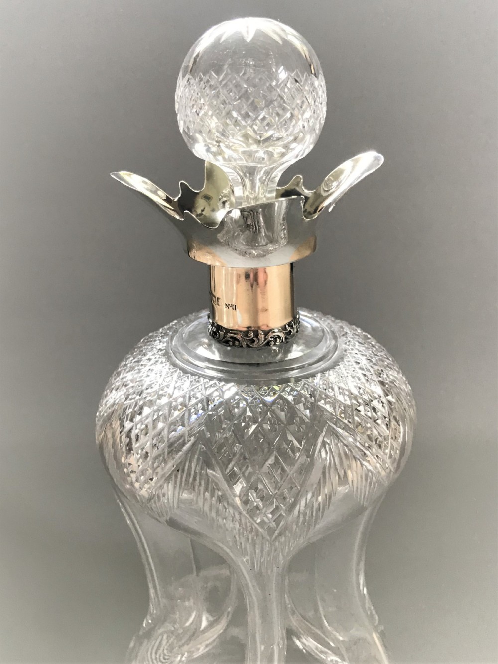 A superb Edwardian silver mounted glug glug decanter View II