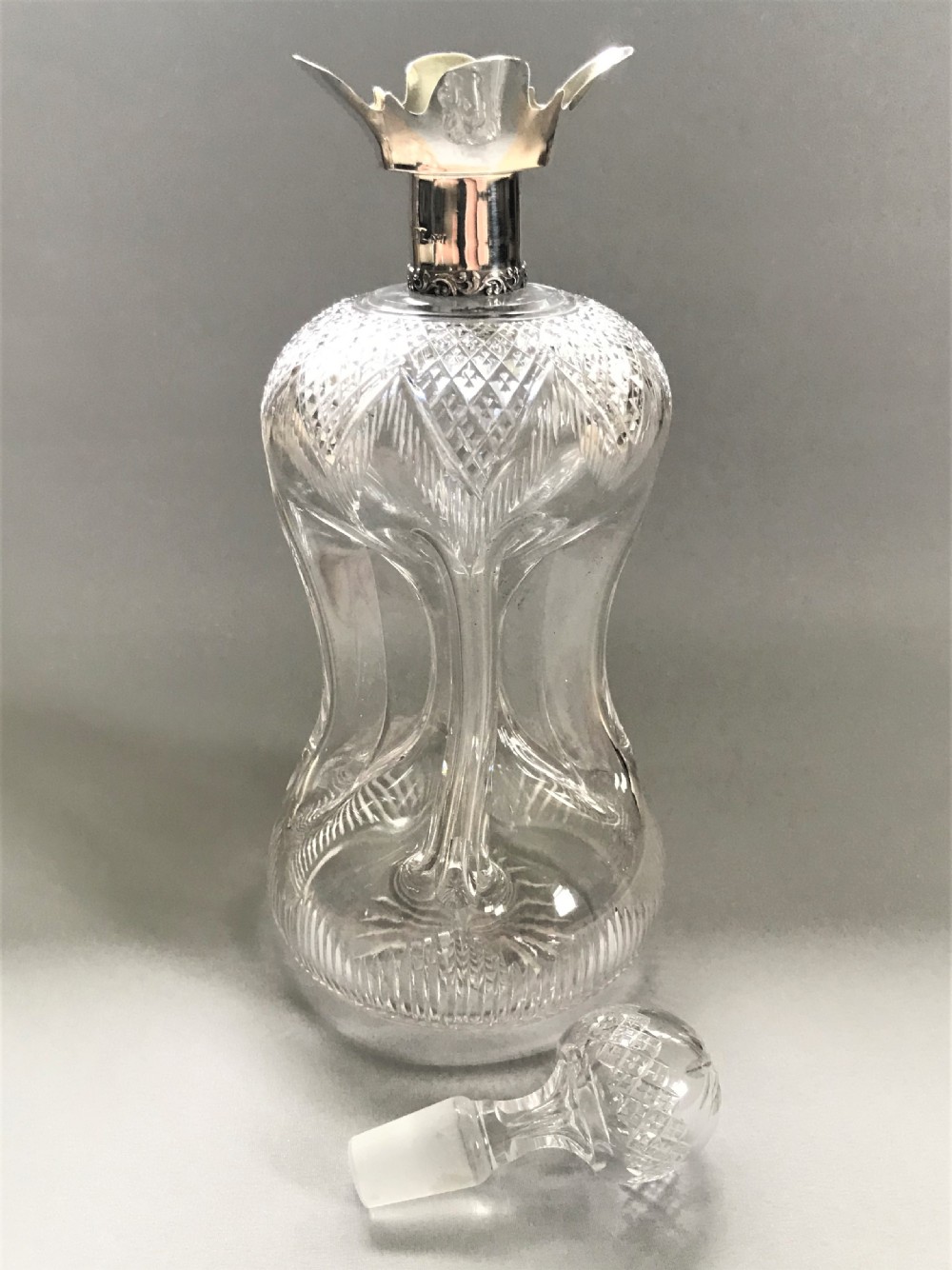 A superb Edwardian silver mounted glug glug decanter View III