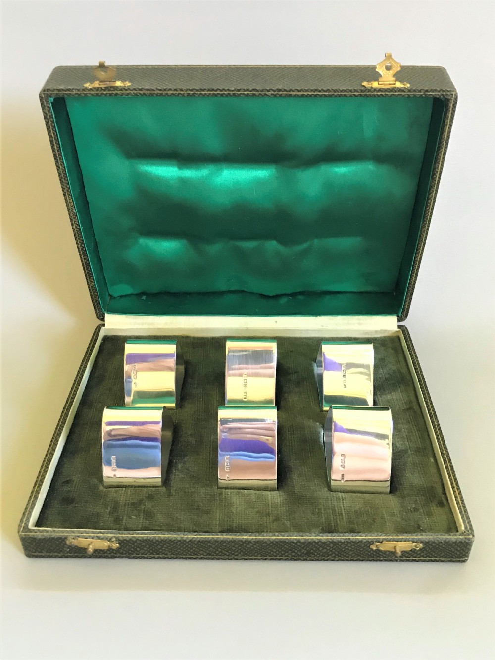 A superb set of 6 boxed silver napkin rings
