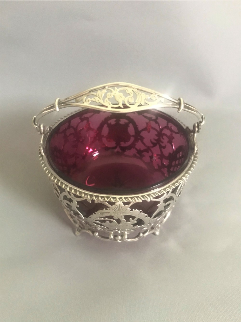A wonderful Edwardian silver & cranberry basket View V