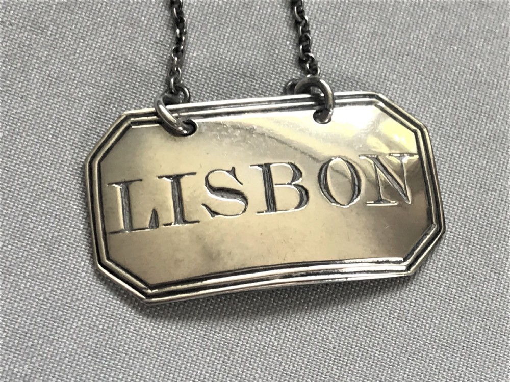 An unusual Georgian silver 'Lisbon' wine label