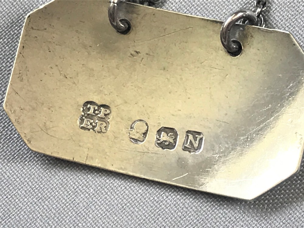 An unusual Georgian silver 'Lisbon' wine label View III