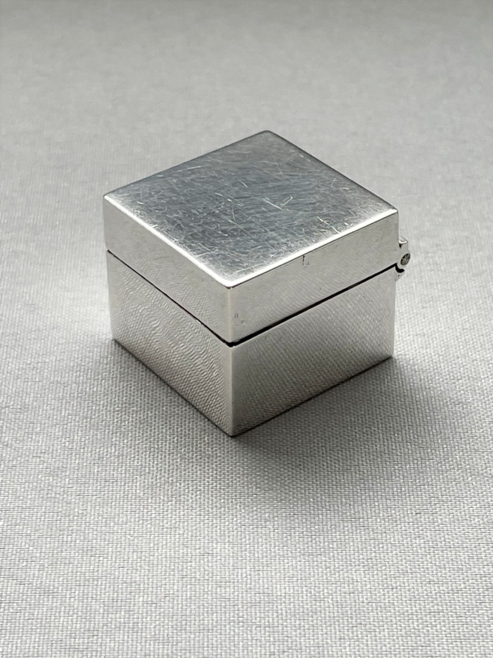 A good Edwardian square silver pill box