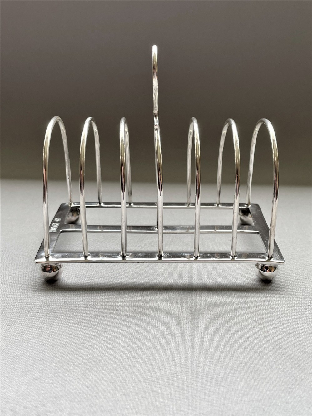 A Georgian revival six slice silver toast rack View IV