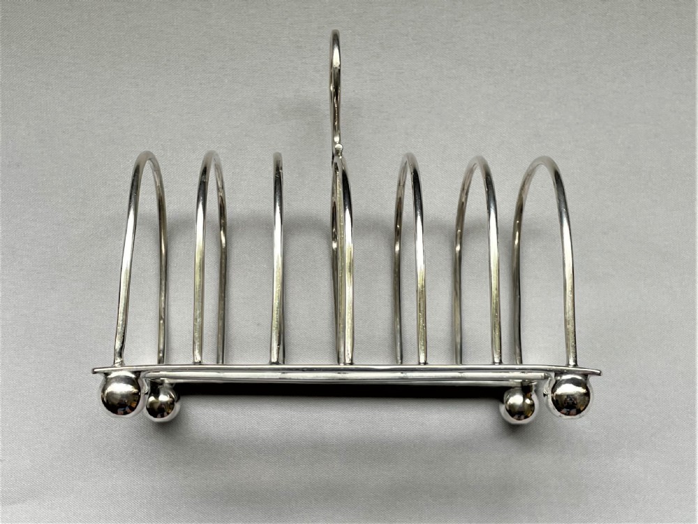A Georgian revival six slice silver toast rack View V