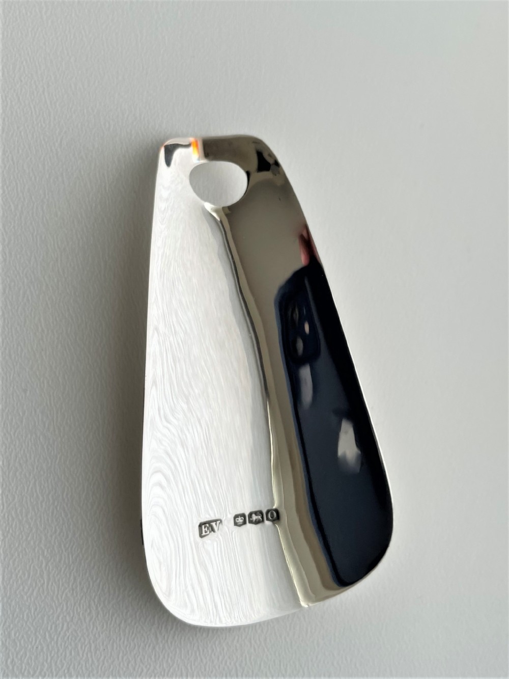 A stylish silver shoe horn