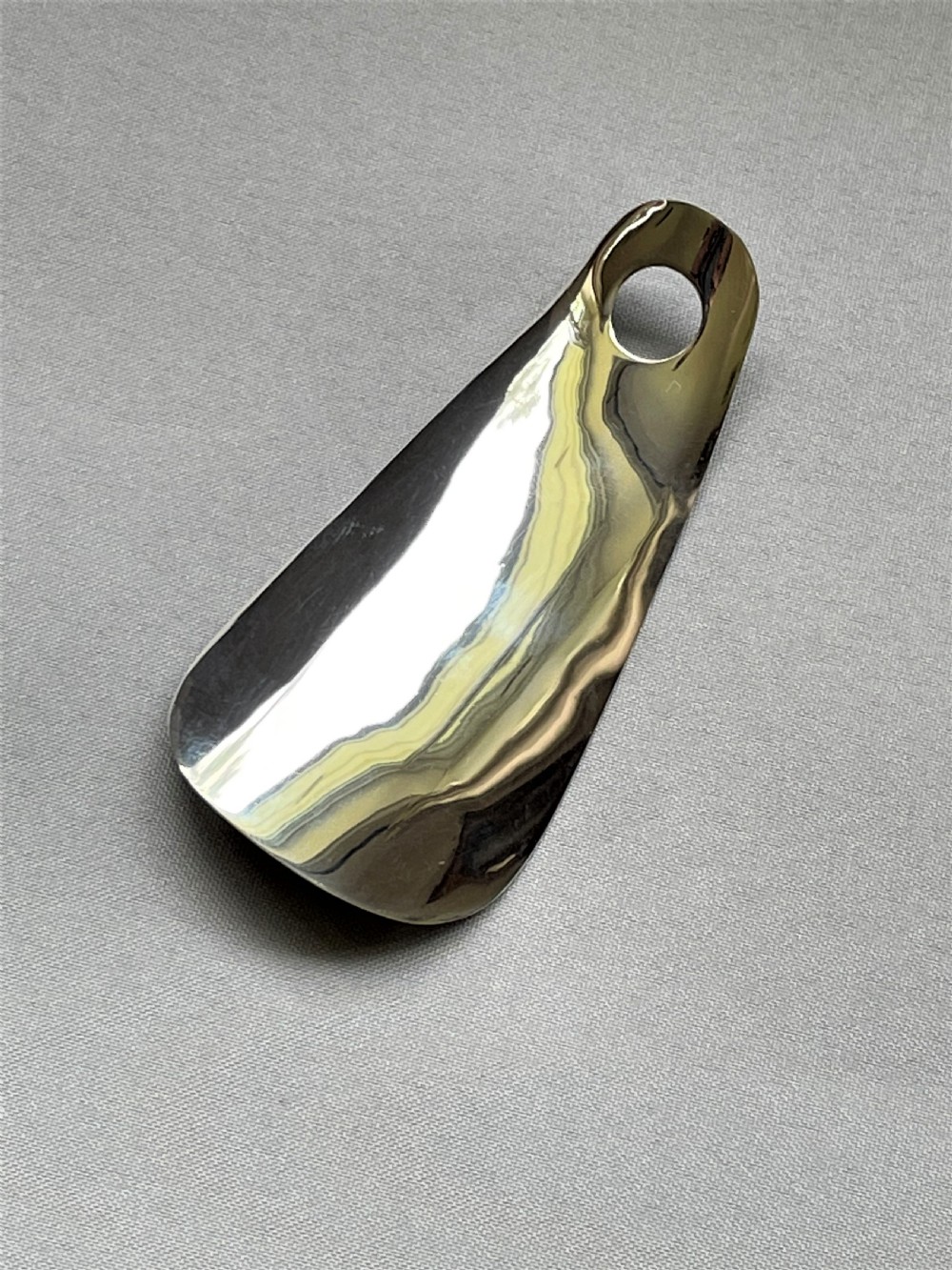 A stylish silver shoe horn View V