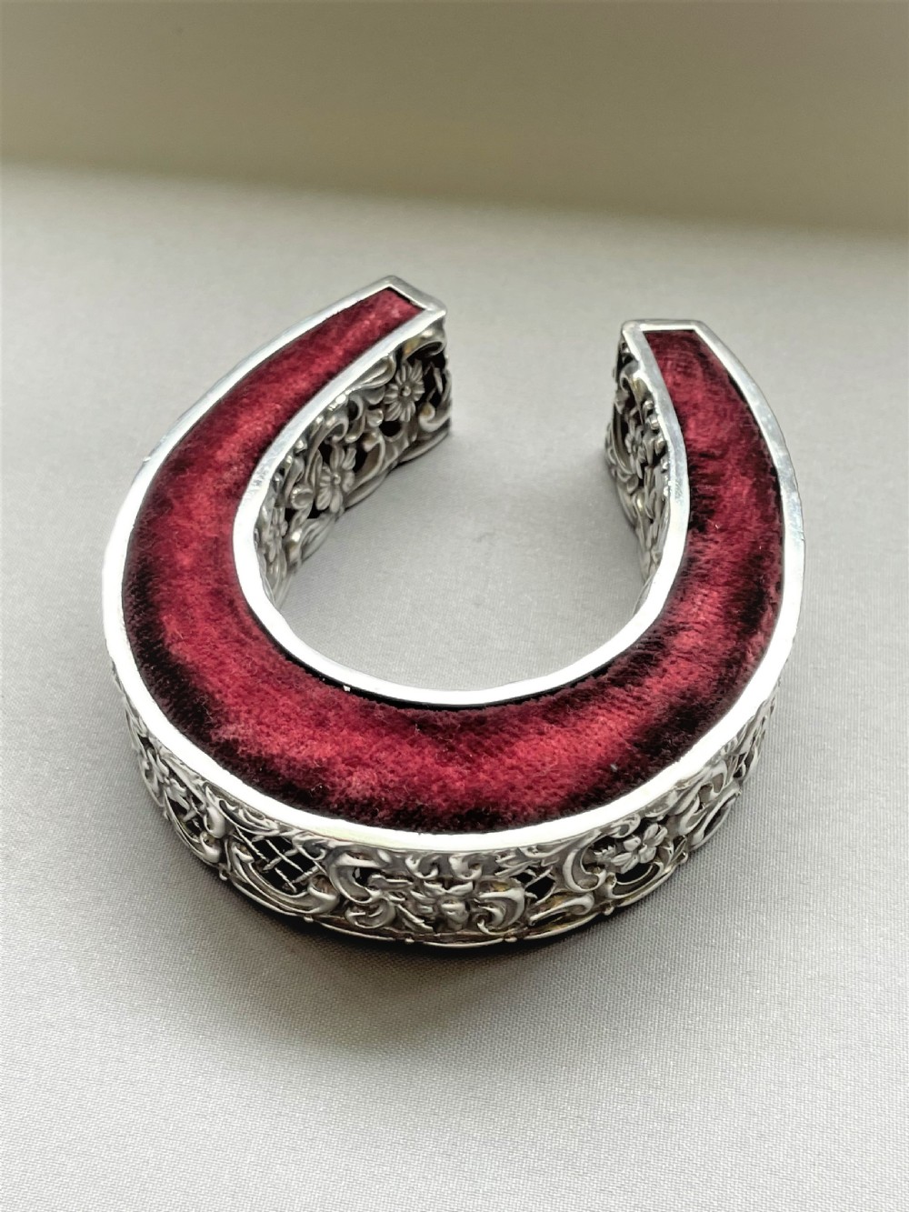 A large Victorian 'lucky horseshoe' silver pin cushion View III