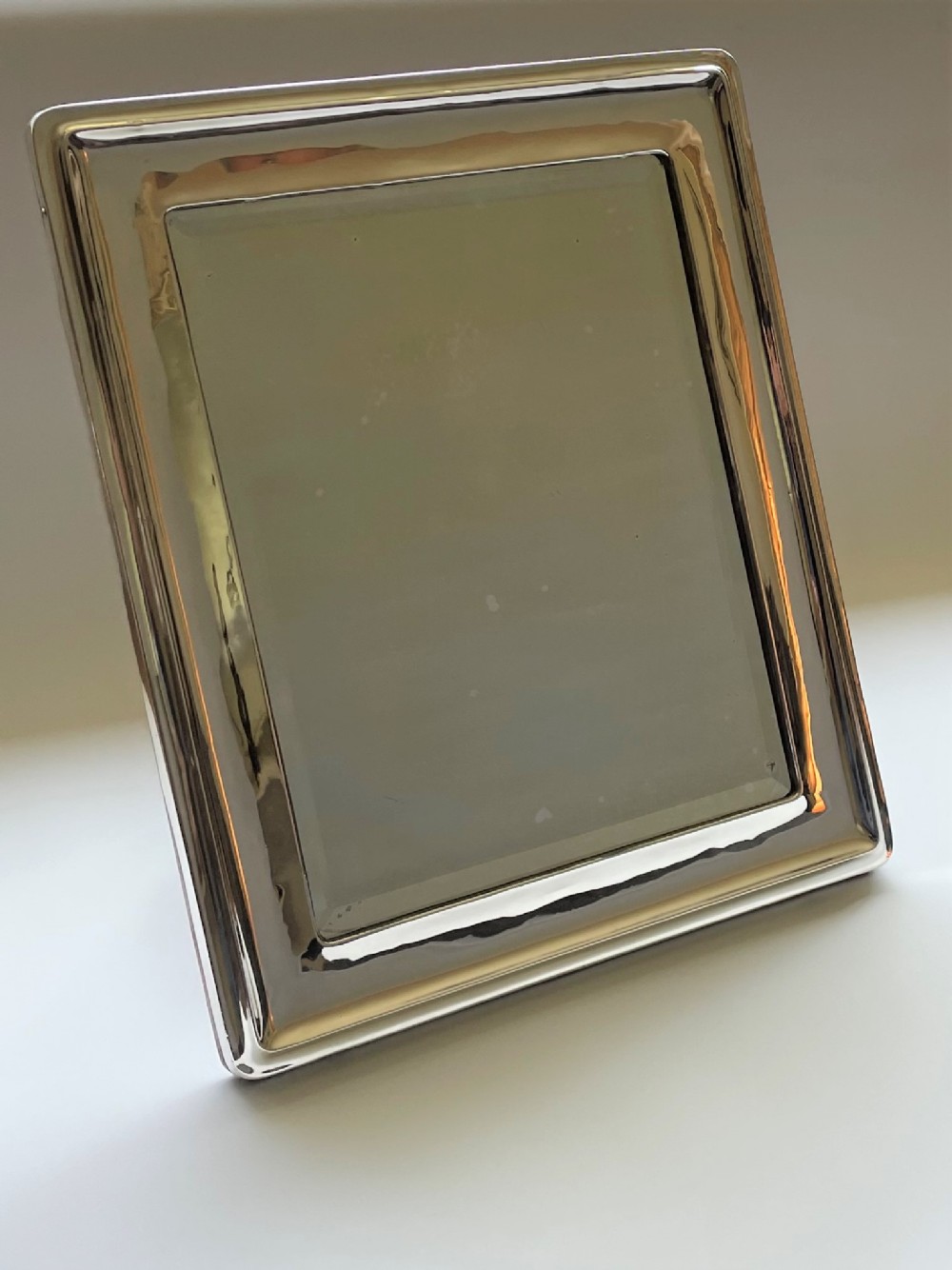 A stylish and desirable George V silver table mirror