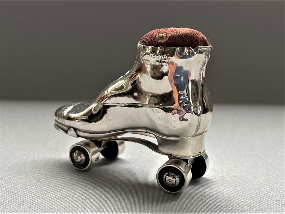An extremely rare Edwardian silver roller skate pin cushion View III