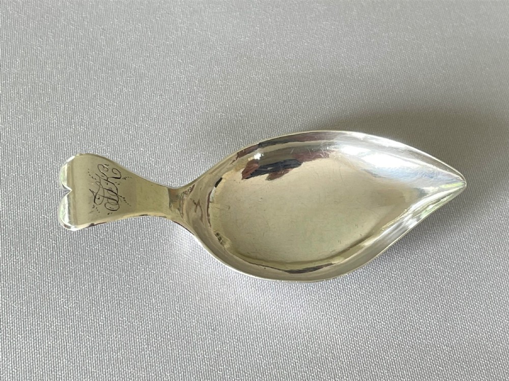 A Georgian silver leaf caddy spoon with heart handle