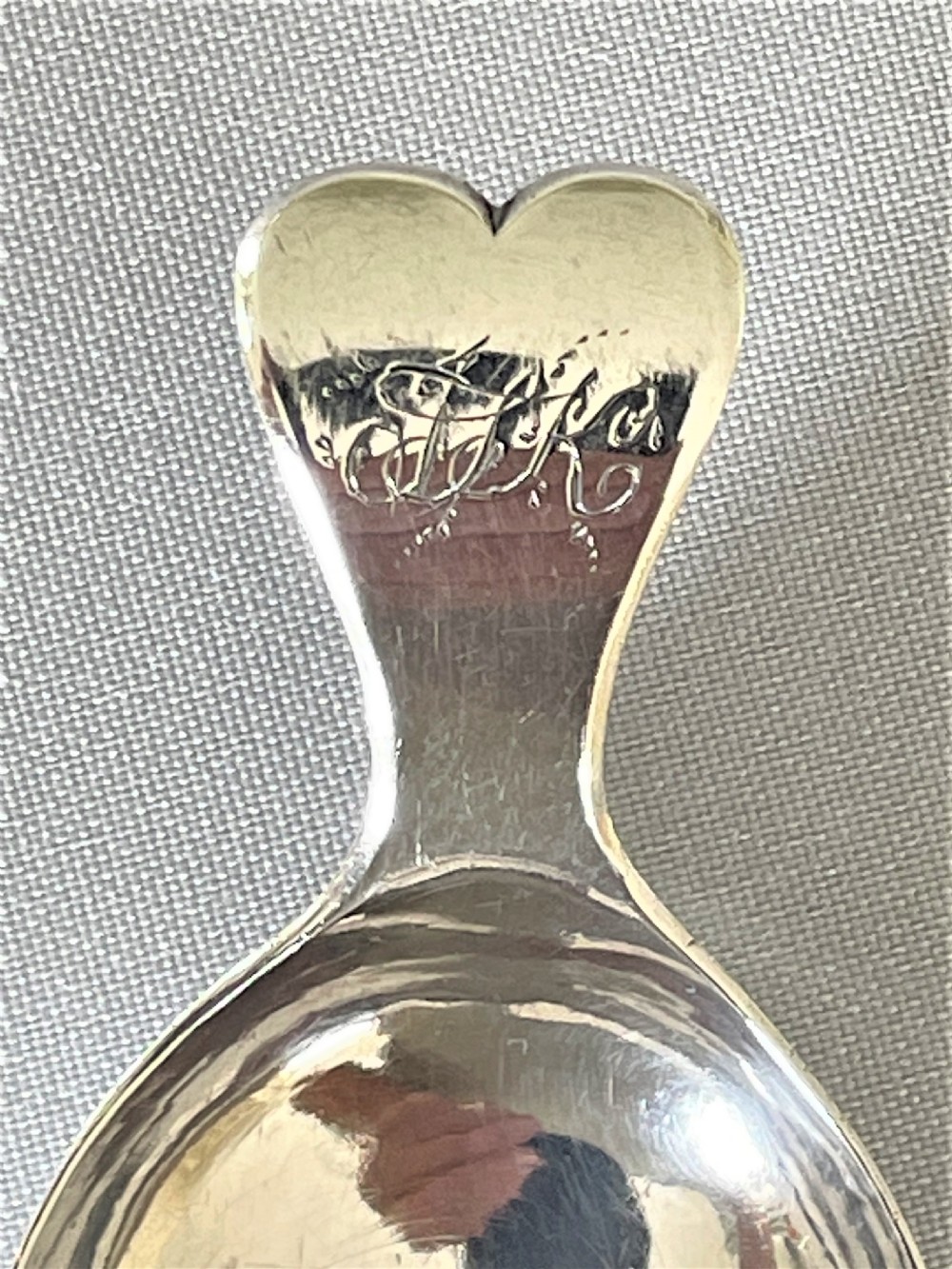 A Georgian silver leaf caddy spoon with heart handle View III