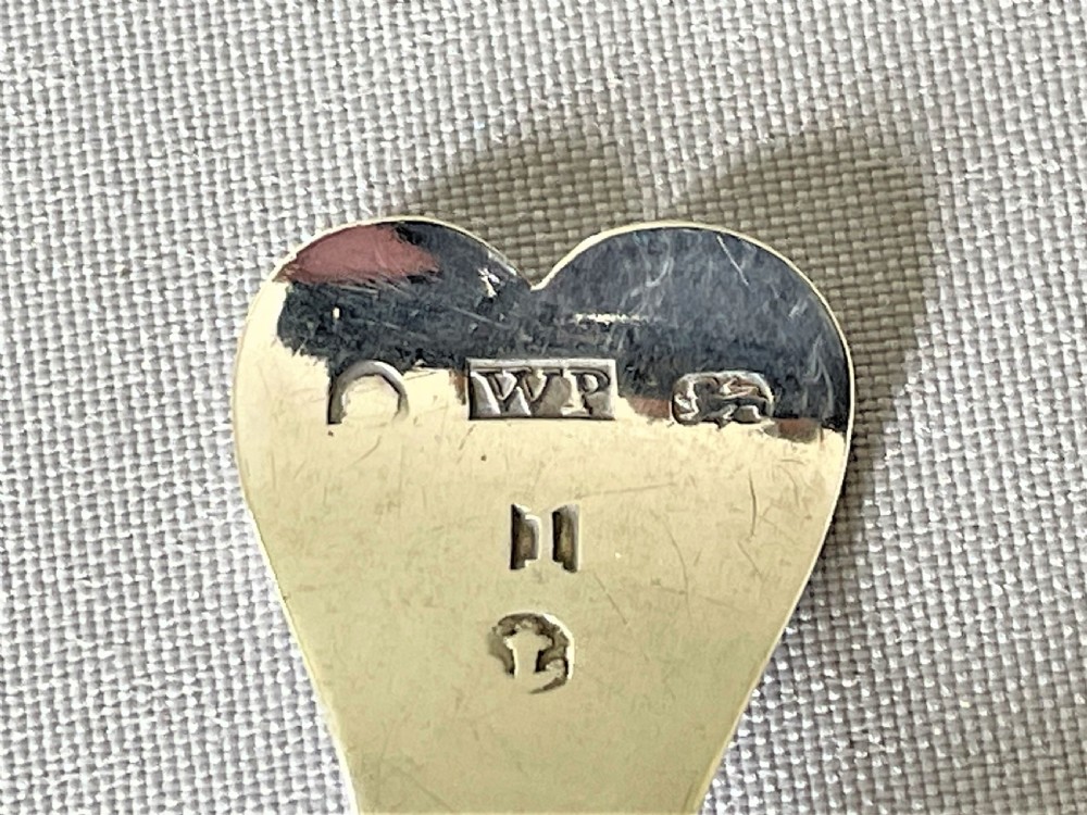 A Georgian silver leaf caddy spoon with heart handle View VI