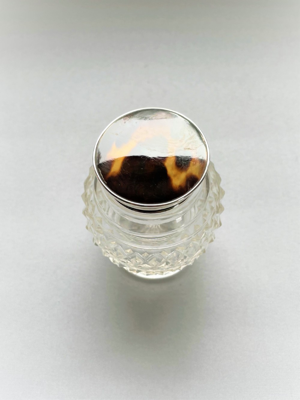 A lovely silver & tortoiseshell mounted cut glass jar