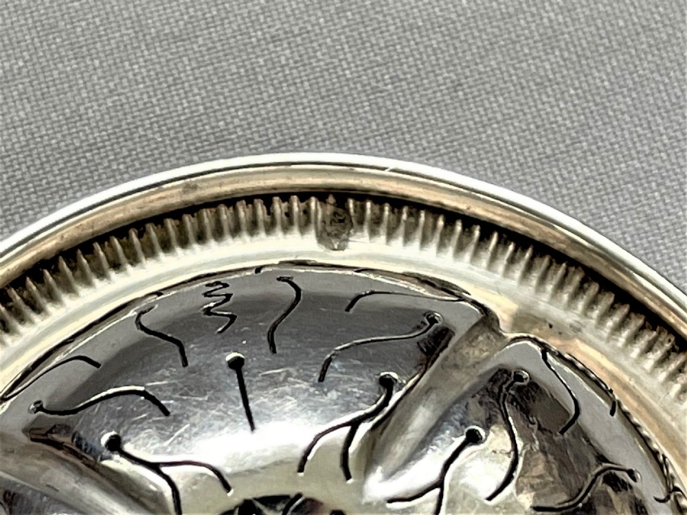 A charming French silver suspension tea strainer View V