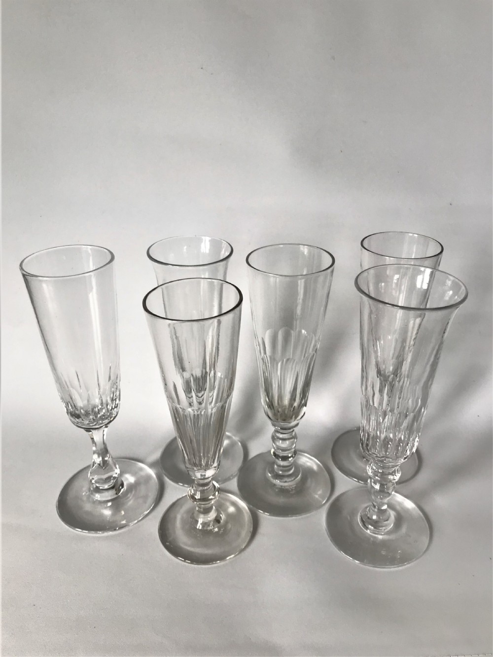 A harlequin set of 6 Victorian champagne flutes View II