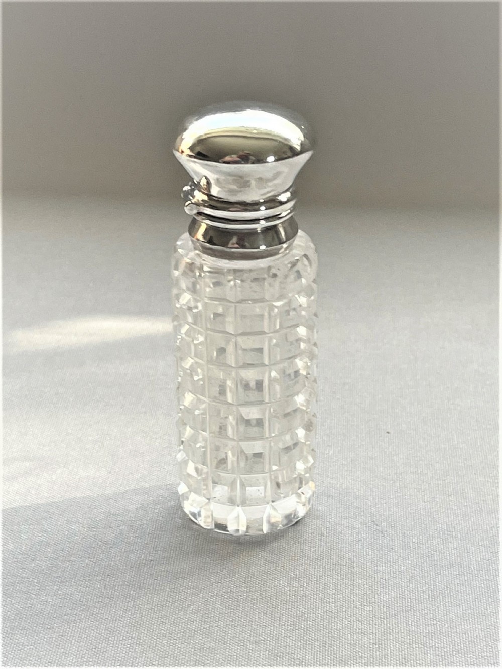 A gorgeous late Victorian silver mounted scent bottle