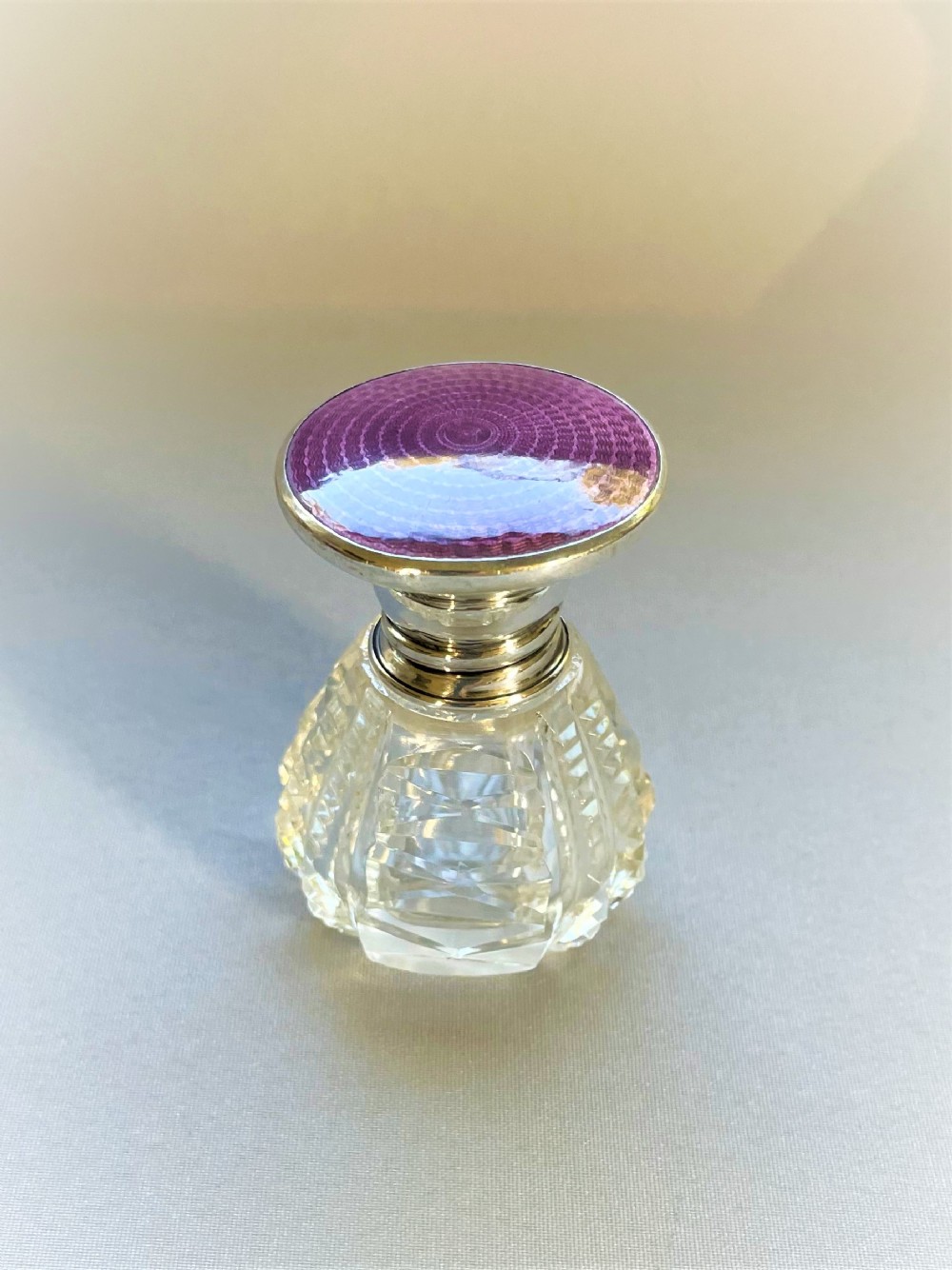 A beautiful silver & enamel lidded scent bottle
