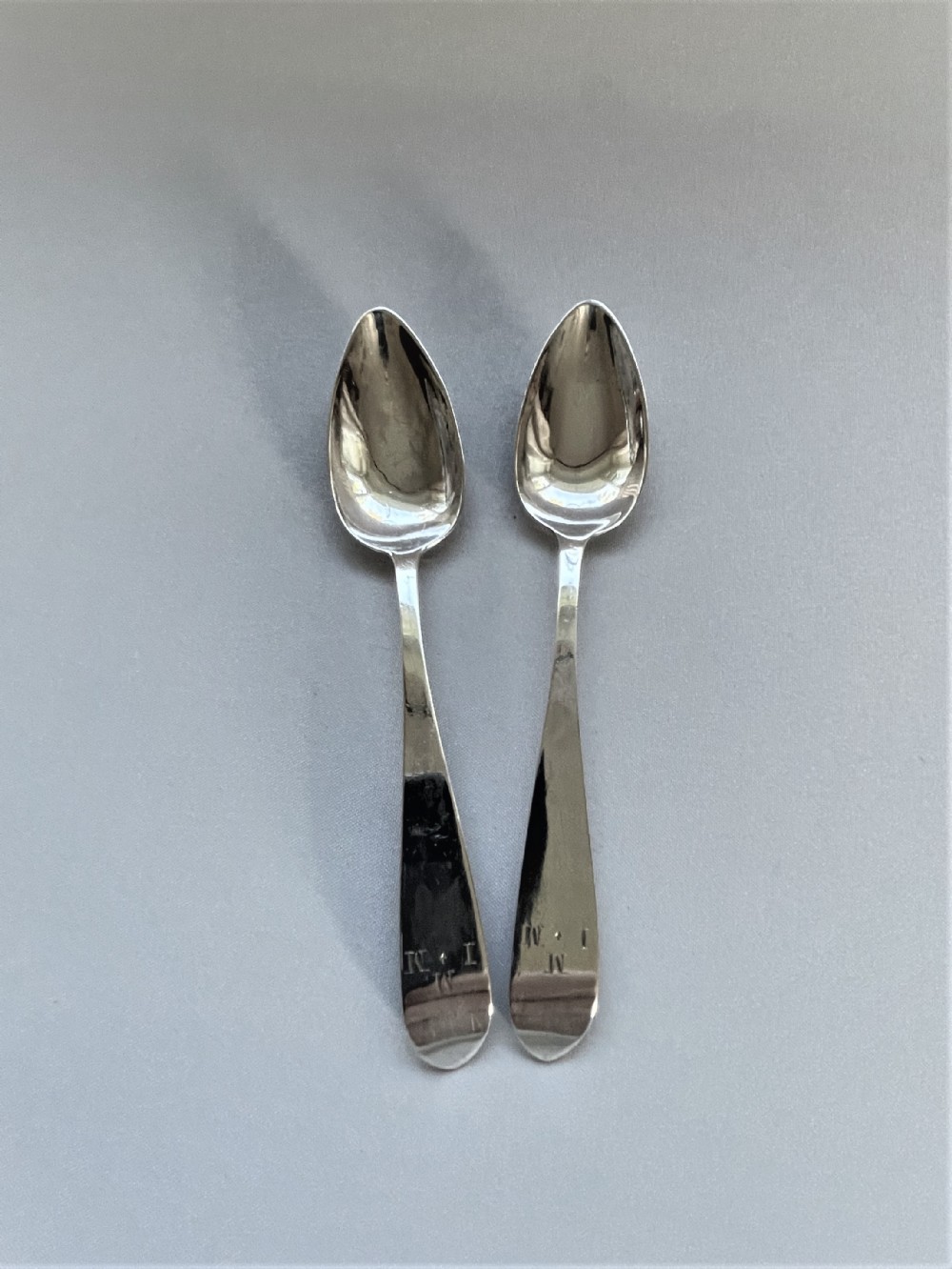 A delightful pair of Georgian Irish silver teaspoons