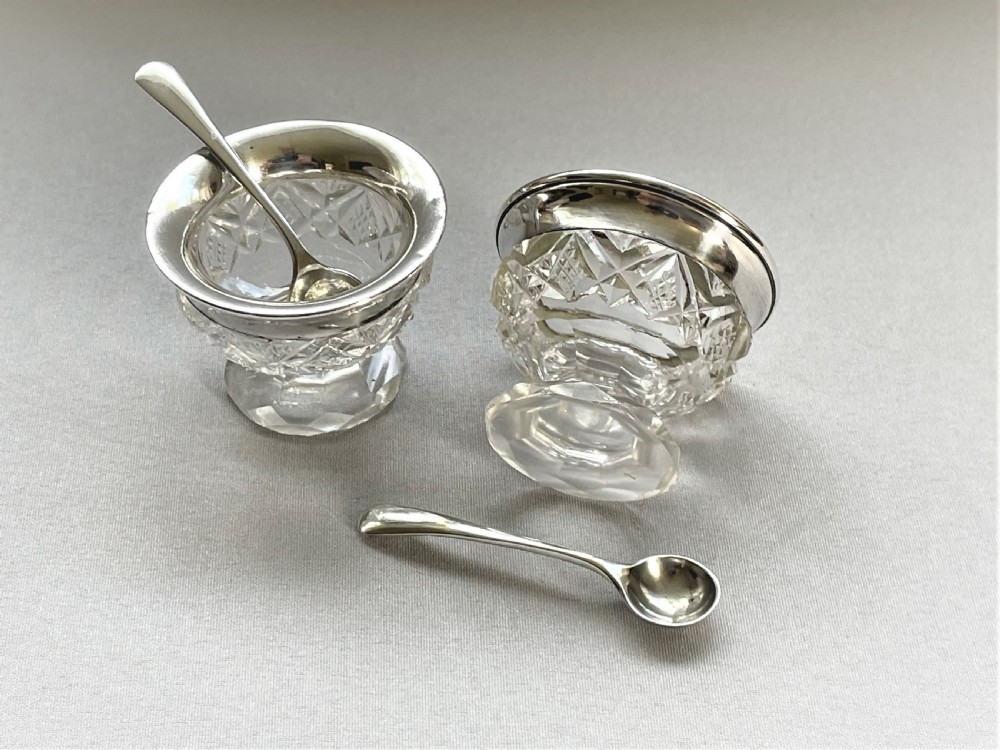 A charming silver mounted salt & pepper duo & spoons View IV