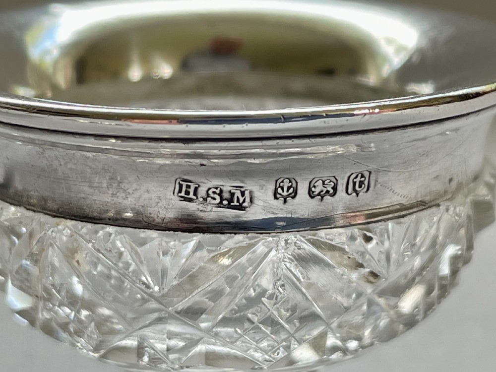 A charming silver mounted salt & pepper duo & spoons View VII