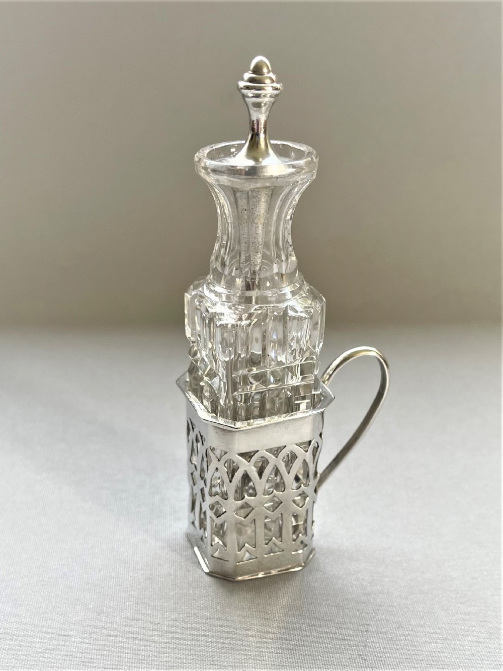 A delightful silver & cut glass Cayenne bottle and spoon