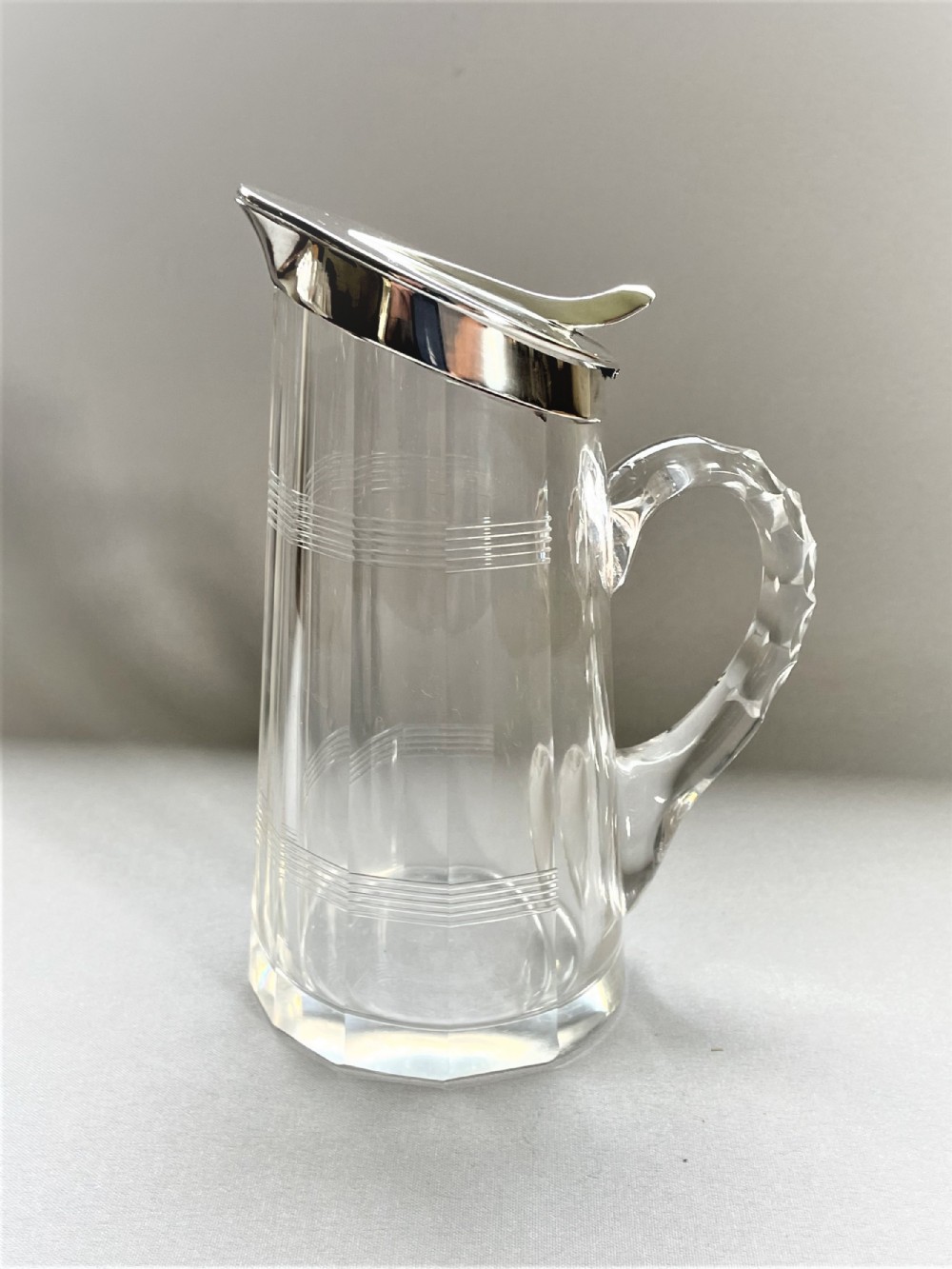 A desirable silver mounted cut glass Whisky companion