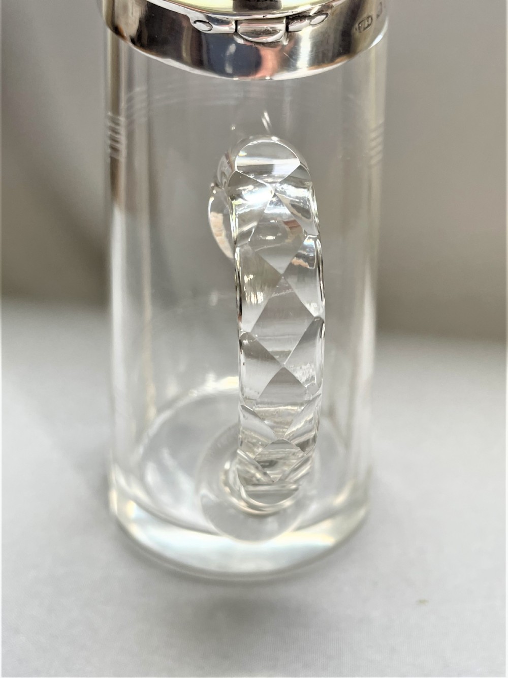 A desirable silver mounted cut glass Whisky companion View IV
