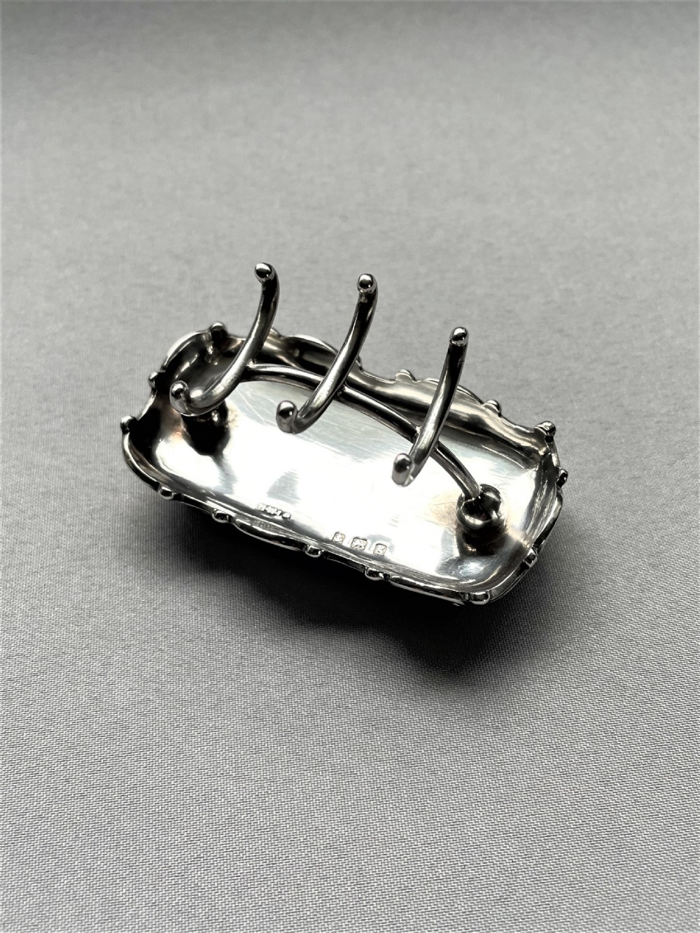 An unusual Edwardian silver ring & trinket stand